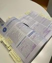 Open textbook with many notes