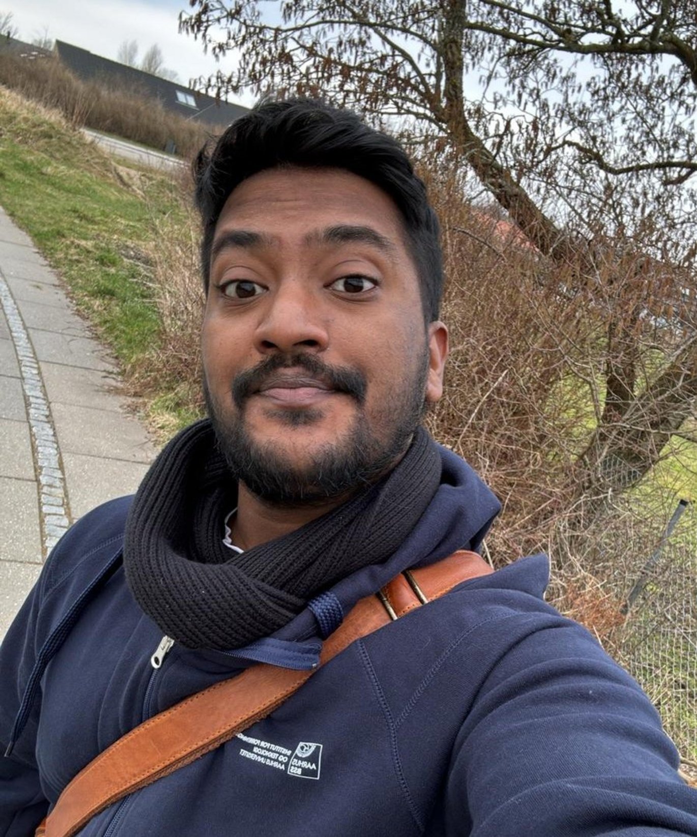 Man taking a selfie in a sweatshirt