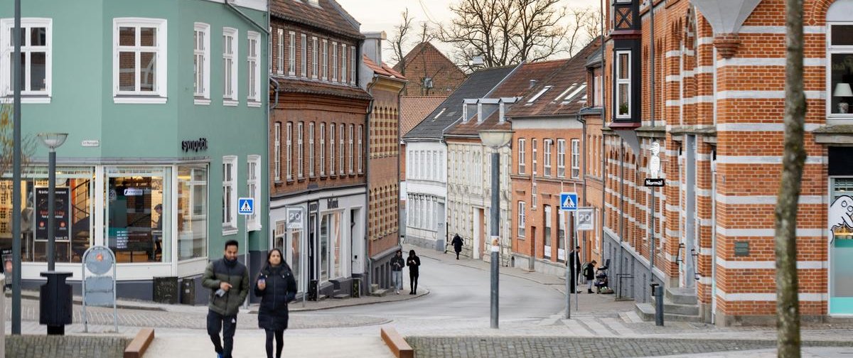 Two people walking in the city centre of Ringsted