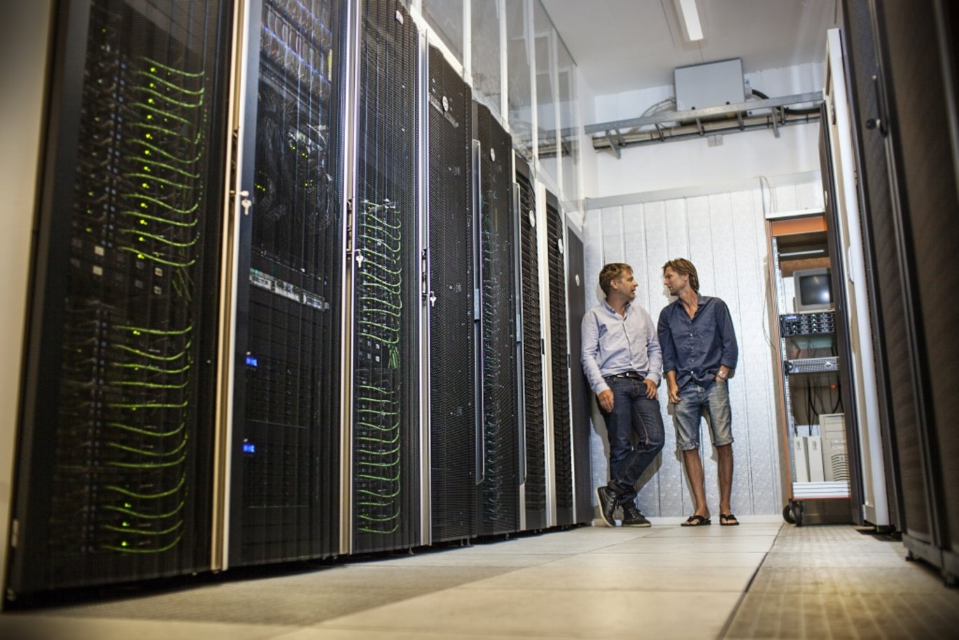 The Genome DK HPC HUB supercomputer at Aarhus University was used for a considerable part of the data processing in connection with mapping the Danish genome. Professor Anders Børglum, Department of Biomedicine (right), is seen here with Professor Mikkel