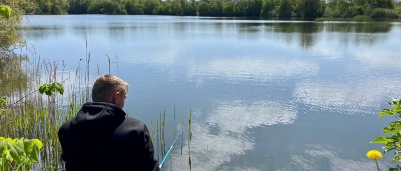 A man fishing in a lake