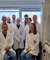 The research team consisting of nine people gathered in lab at Aarhus University.