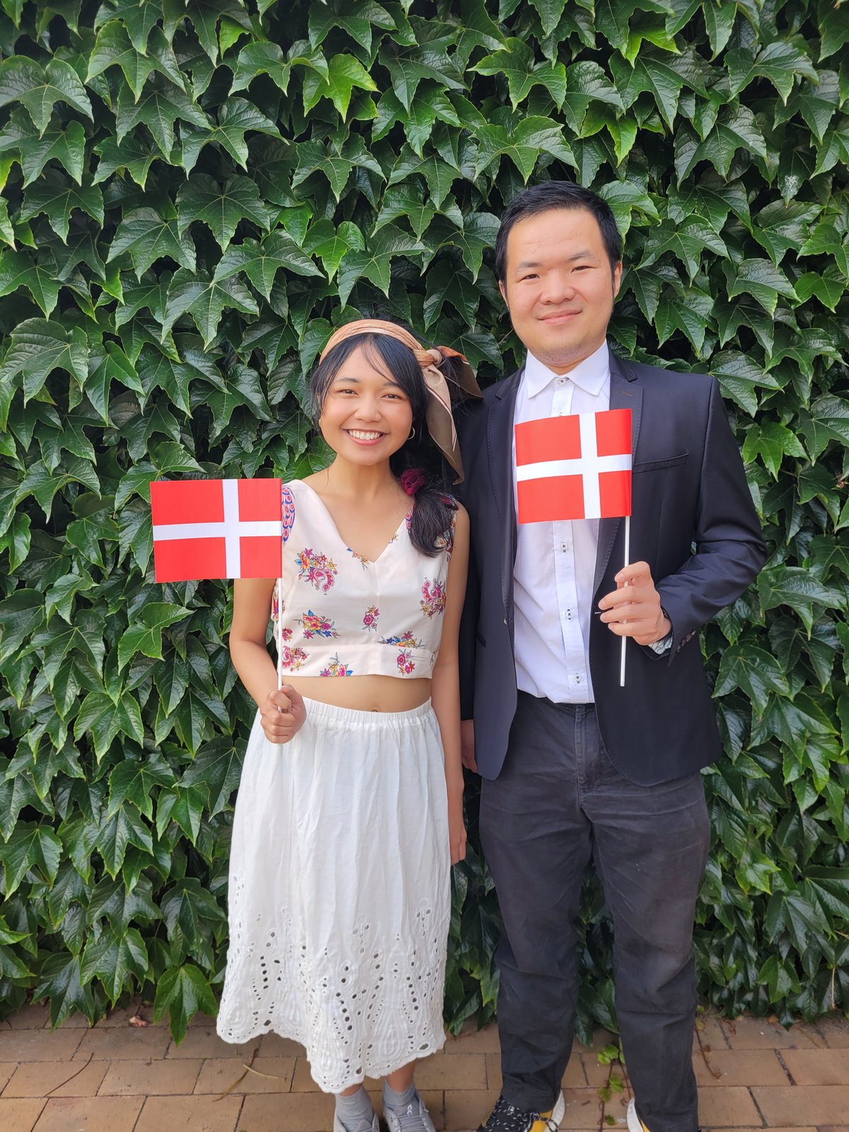 Two indonesian students holding Danish flags