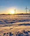 Wind turbines in a landscape full of snow