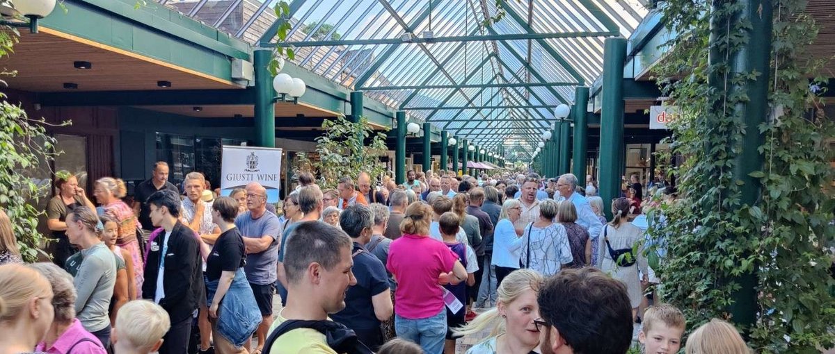 A crowd of people in a mall