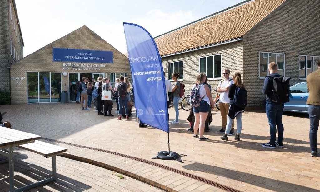 A line of students outside the International Centre
