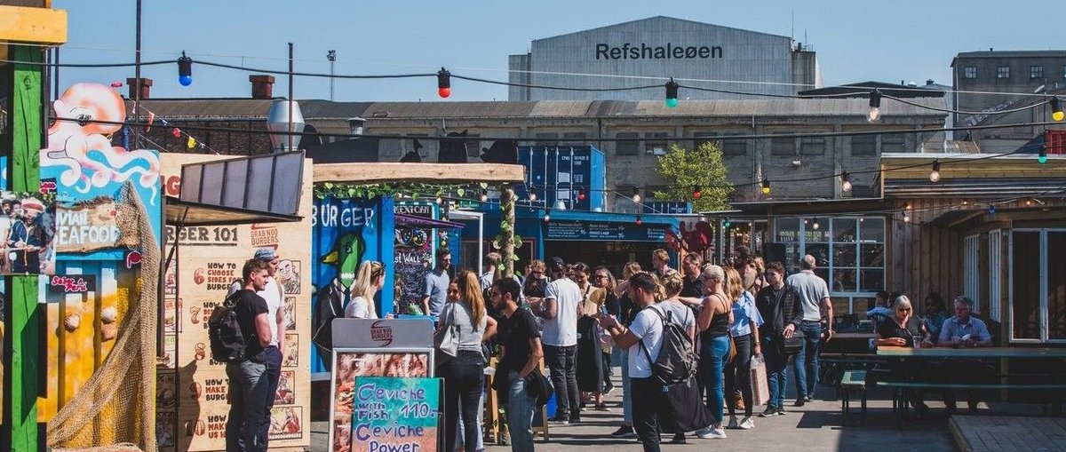A crowd of people at a street food market