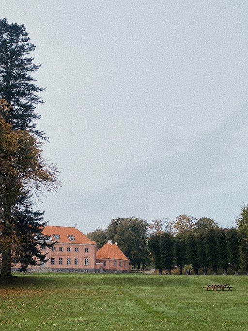 A building on a side of a field