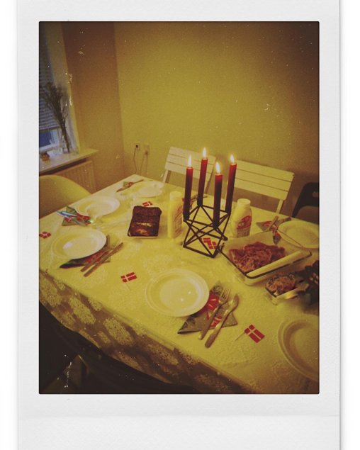 A set up table with four Christmas lights in the middle